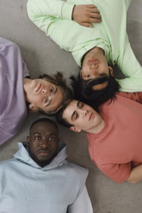 Group of men gathered together, symbolizing discussions about masculinity, belonging, and emotional well-being.