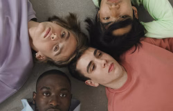 Group of men gathered together, symbolizing discussions about masculinity, belonging, and emotional well-being.